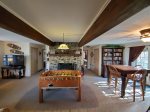 Bottom Level: Rec room also features foosball table, wood burning fireplace, card table, library/game hutch